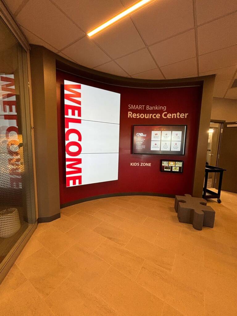 CNB Bank State College SMART Banking Resource Center with 'Welcome' display, digital tools, and Kids Zone.